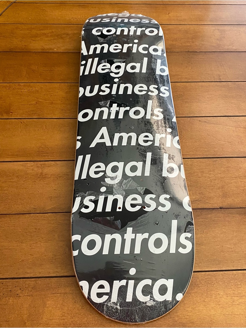 Supreme Skateboard Deck Black White Script Illegal Business Controls America